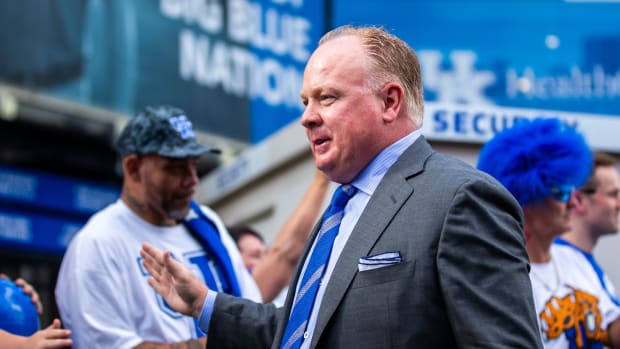 Oct 2, 2021; Lexington, Kentucky, USA; Kentucky Wildcats head coach Mark Stoops greets fans at Cat Walk before the game against the Florida Gators at Kroger Field. Mandatory Credit: Jordan Prather-USA TODAY Sports